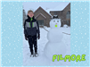 young boy with a snowman that has a tennis ball mouth